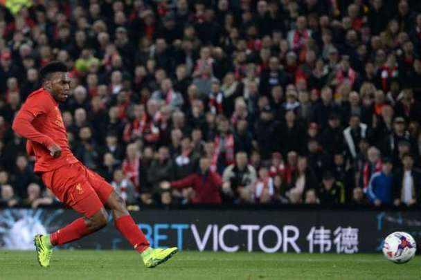 Liverpool's English striker Daniel Sturridge shoots to score their second goal during the English Football League Cup fourth round match between Liverpool and Tottenham Hotspur at Anfield in Liverpool north west England on October 25, 2016