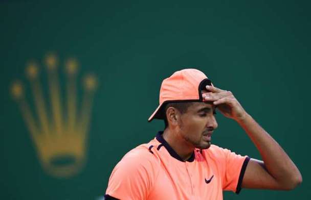 Australia's Nick Kyrgios was fined for a lack of effort, swearing and arguing with fans during the Shanghai Masters