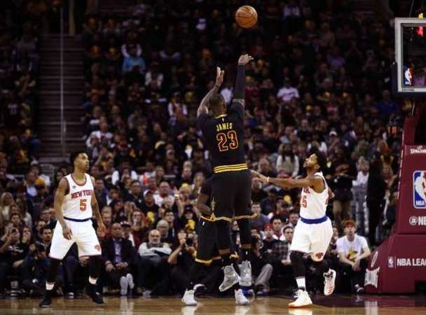 LeBron James #23 of the Cleveland Cavaliers shoots in the first quarter against Derrick Rose #25 of the New York Knicks on October 25, 2016 in Ohio